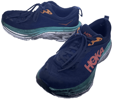 dark blue wide bottom sneakers labelled 'Hoka'.